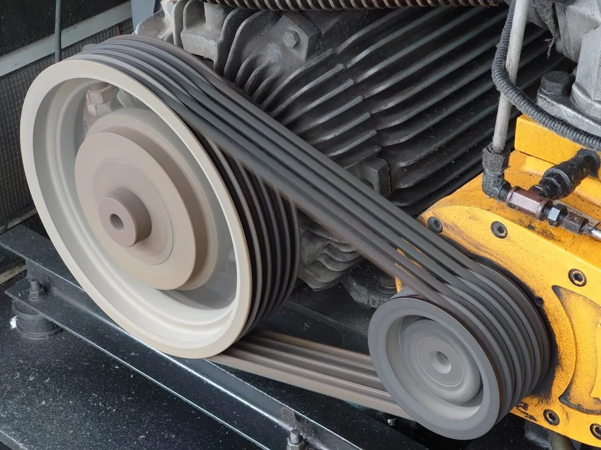 Industrial V belts running on machine pulleys